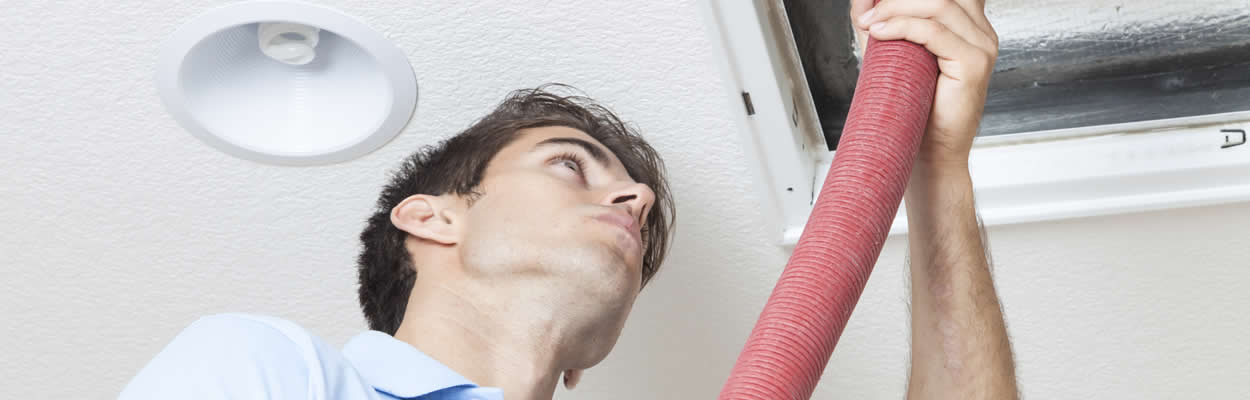 Hvac Tech Cleaning Out Ducts