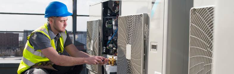 Tech Repairing Commercial Hvac System Tech Repairing Commercial Hvac System